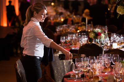 A student pouring wine at A Night in the Valley