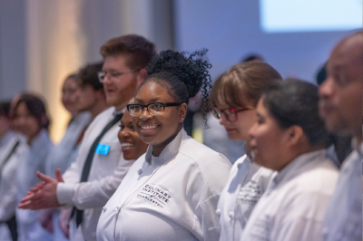 Congratulating students for their hard work at A Night in the Valley