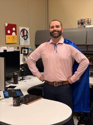 Photo of Bryan Smith with hero cape