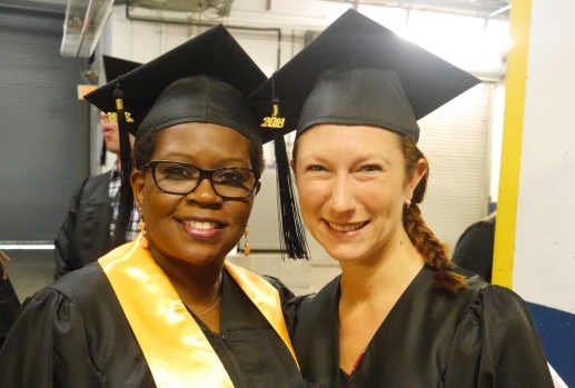 Two women in cap and gown