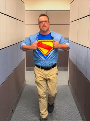 Photo of John Singleton with hero cape