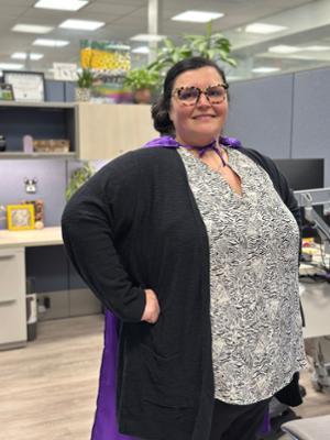 Photo of Shannon Jones wearing a hero cape