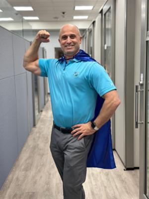Photo of Michael Kelly with hero cape