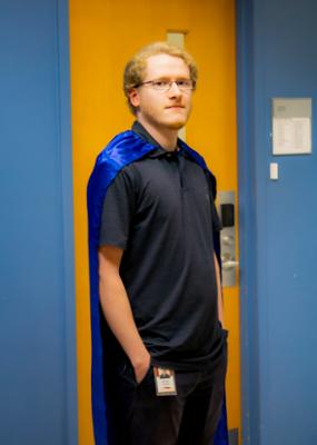 Photo of Mike Thomas with hero cape