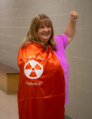 Photo of Becky Sims with hero cape