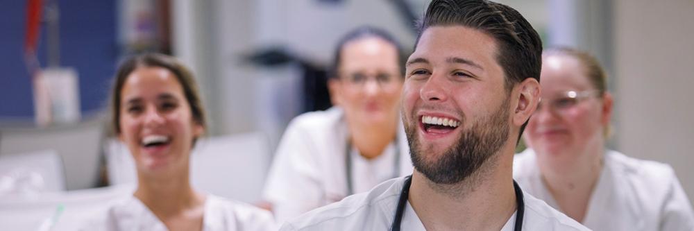 Trident Tech medical students laugh during class.