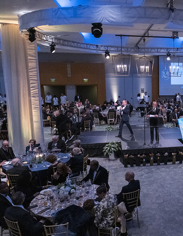 The ballroom during the live auction at the 2026 event, seen from above. Left side of the image.