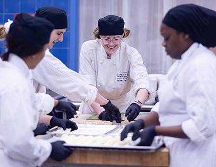 Culinary students preping food