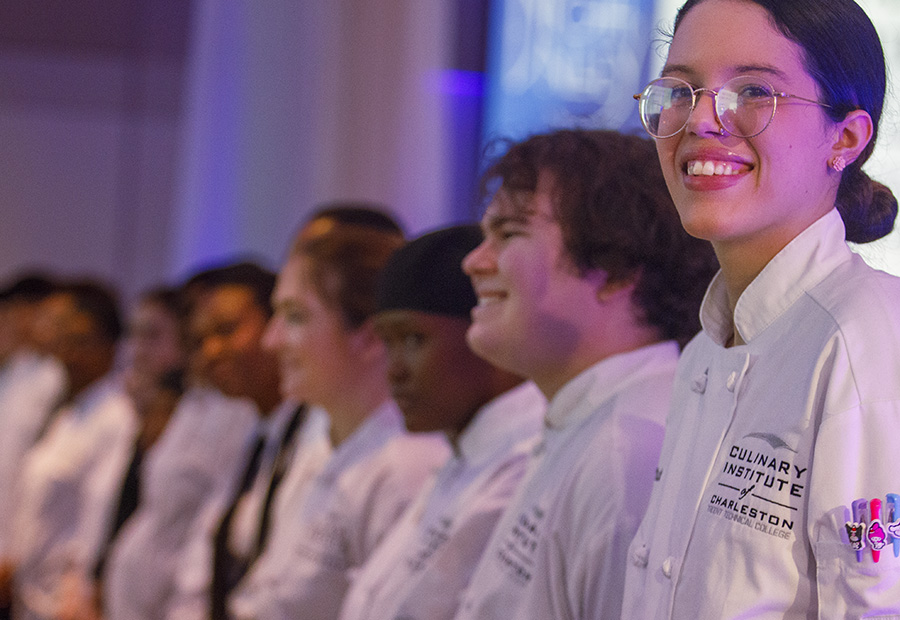 Students applauding in the audience at the 2026 event.