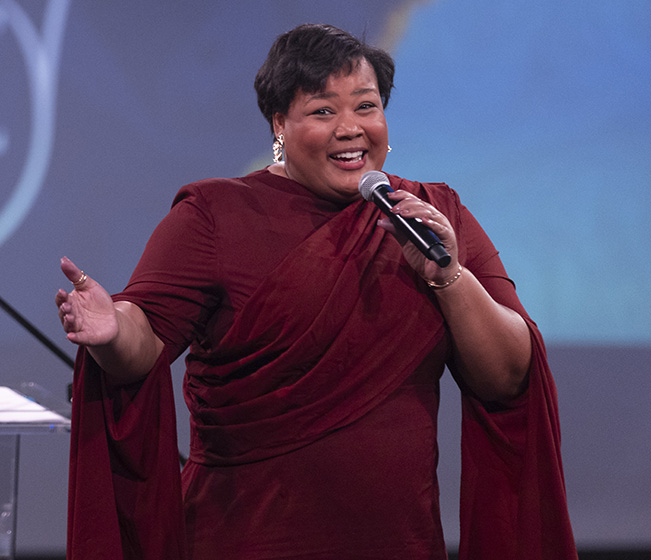 A singer performing on stage.