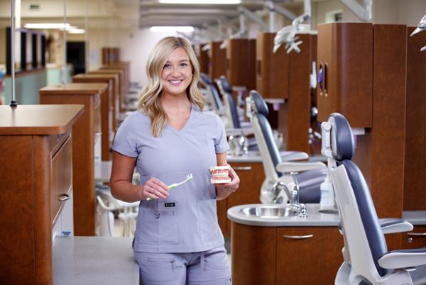 Female dental student in clinic