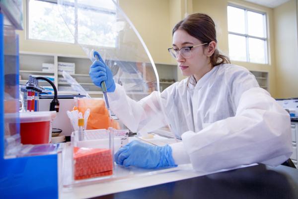 Female student in MLT lab performing tests