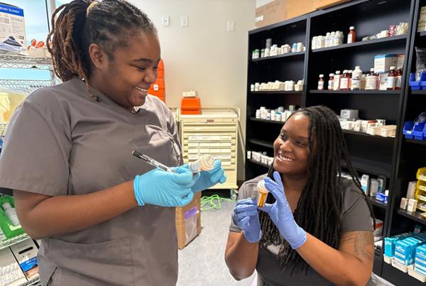 Pharmacy Technician students performing a lab exercise