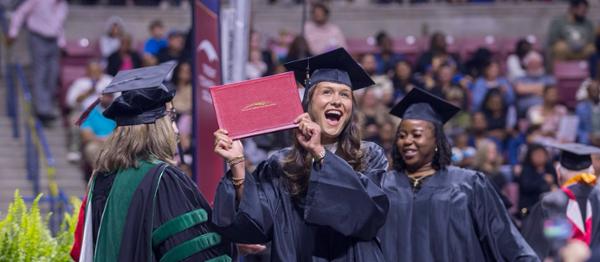Smiling graduate at commencement