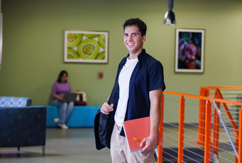 Student with backpack on campus