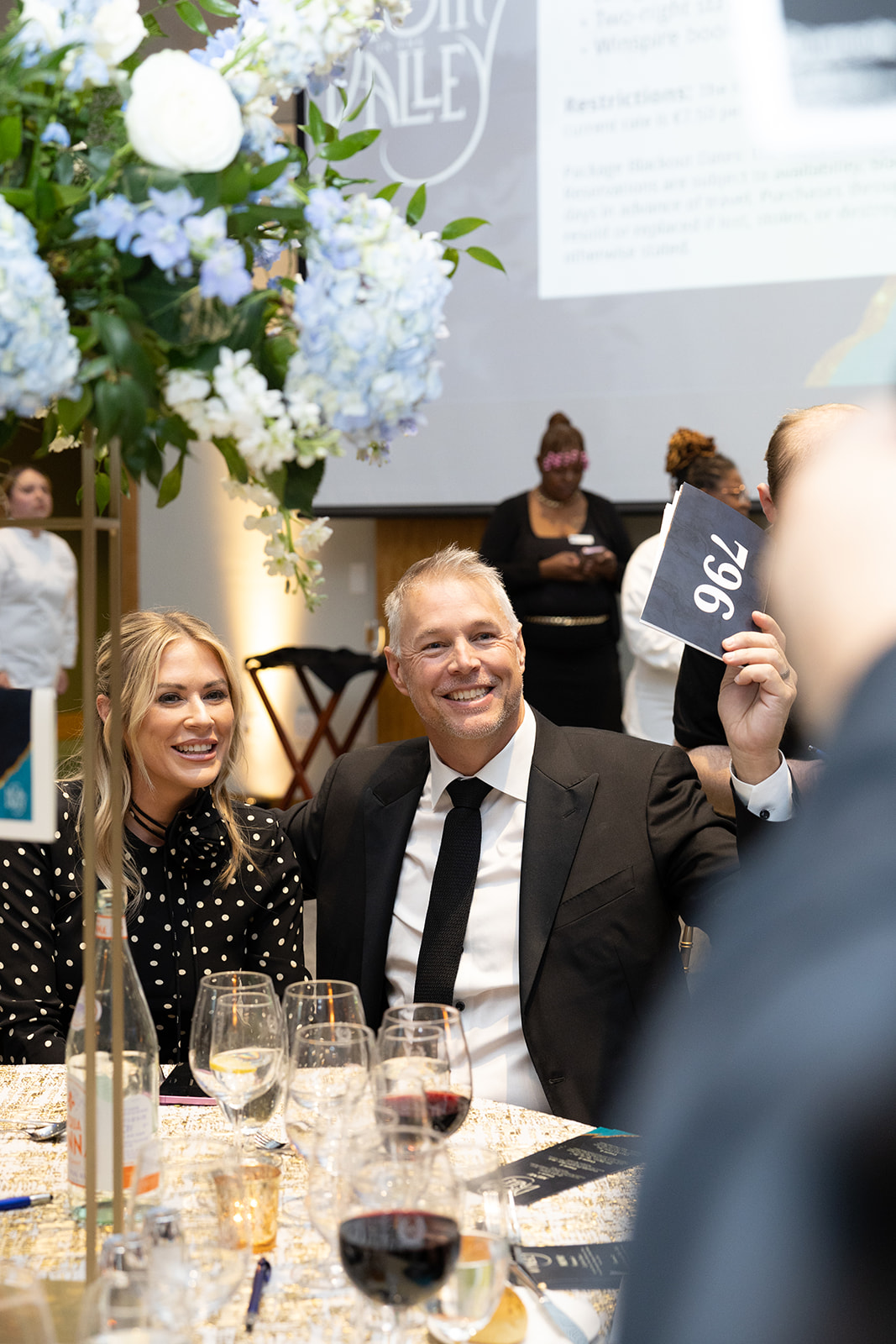 Guests enjoy dinner and the live auction at the 22nd annual A Night in the Valley. 