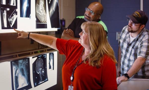 Healthcare professionals review X-ray film