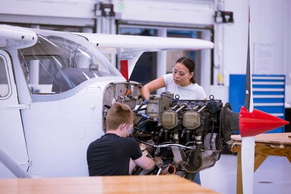 Students working on aircraft