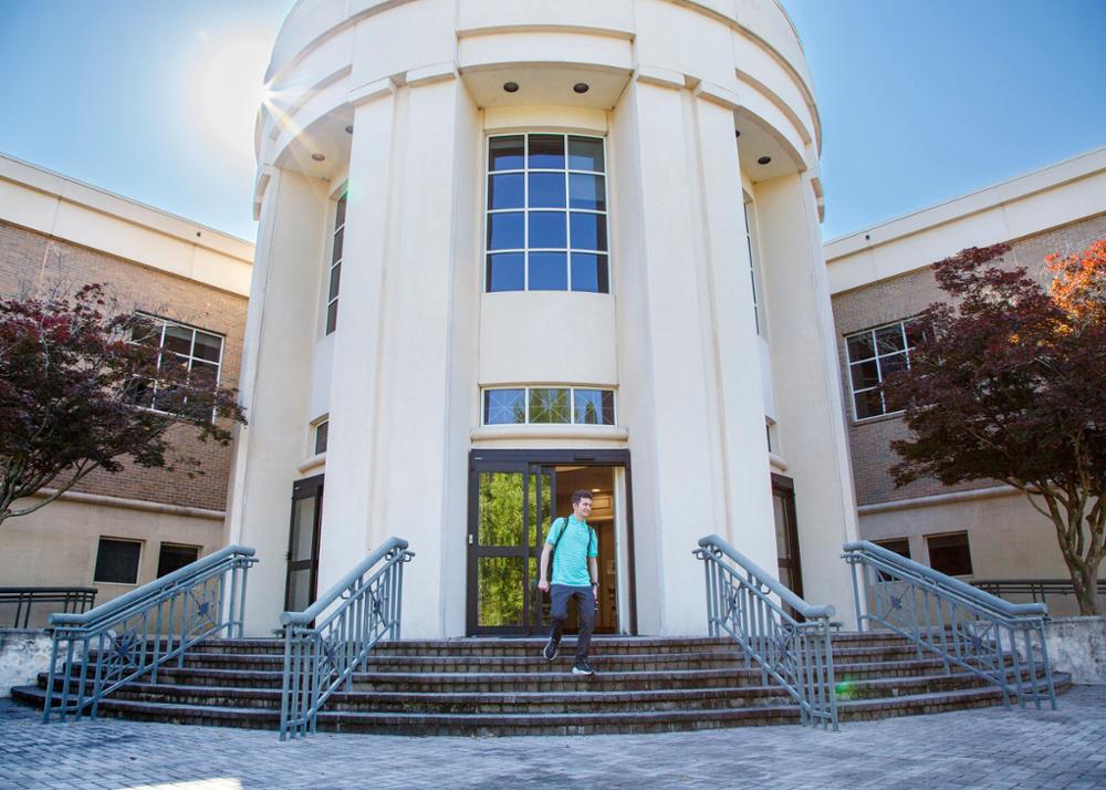 Student walking out of the library