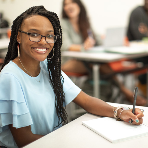 A student with a learning device.
